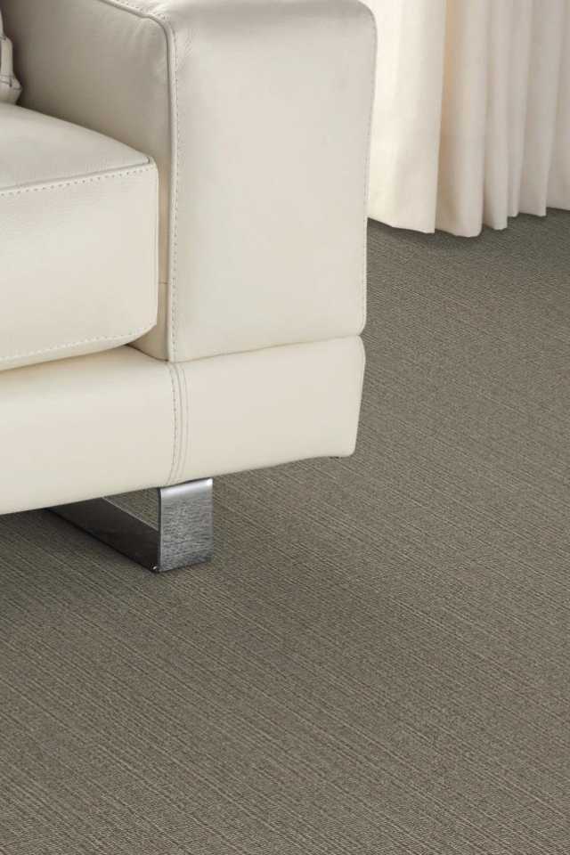 close up of gray wool carpet in modern white living room